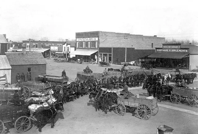 Wheat wagons on Broadway Avenue in Protection, Kansas.