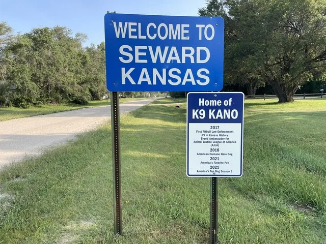 Sign that says 'Welcome to Seward Kansas' Which also displays it is the home of 'K9 NANO'