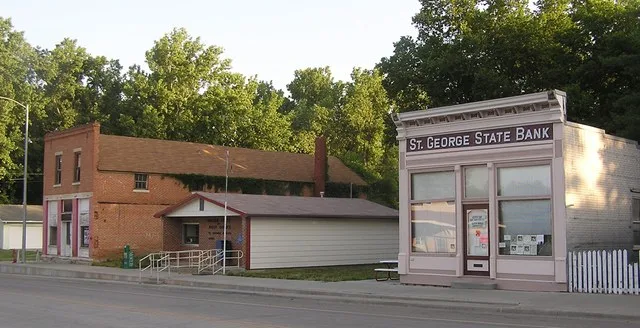 First Street in St. George, Kansas in May 2012, showing the St. George Bank building, now used as a city hall, and the St. George post office.