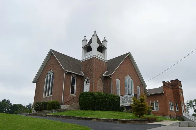 Front and southern side of the Burnside Methodist Church , located on the western side of Central Avenue in Burnside , Kentucky , United States . Built in 1907, it is listed on th...