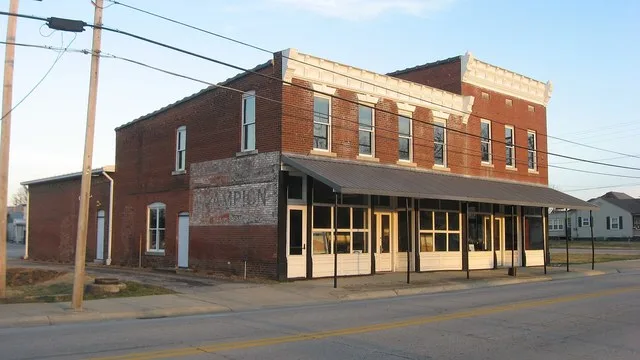 Front and northern side of the J.B. Taylor and Son Feed Store (left) and front of the Lewisport Masonic Lodge (right), located at 307 and an unspecified address on Fourth Street (...