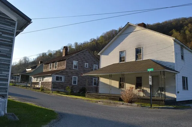 Houses at the western end of First Street, seen from Pirate Way, in Lynch , Kentucky , United States . These houses are part of the Lynch Historic District , a historic district t...
