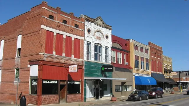 Buildings on the northern side of the 100 block of W. Main Street ( Kentucky Route 56 ) in downtown Morganfield , Kentucky , United States . This block is part of the Morganfield...