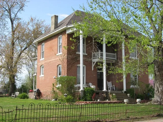 Front and southwestern side of the W.W. Kington House , located at 109 Crooked Street in Mortons Gap , Kentucky , United States . Built in 1911, it is listed on the National Regis...
