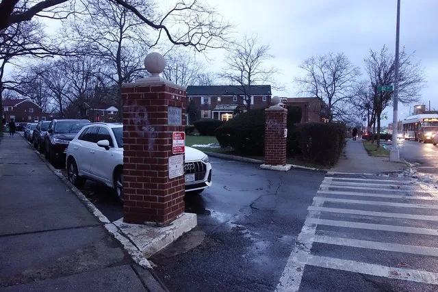 A brick gate into the east end of the Parkway Village development, at Parsons Boulevard and Village Road / 82nd Drive in Briarwood / Jamaica Hills, Queens.