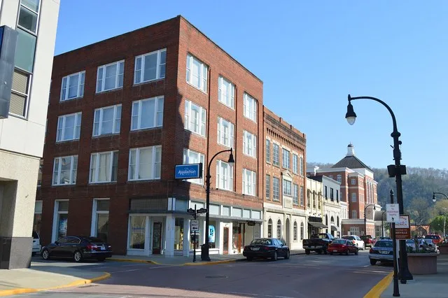 Buildings on the western side of Main Street at the Grace Avenue intersection in downtown Pikeville , Kentucky , United States . This block is part of the Pikeville Commercial His...