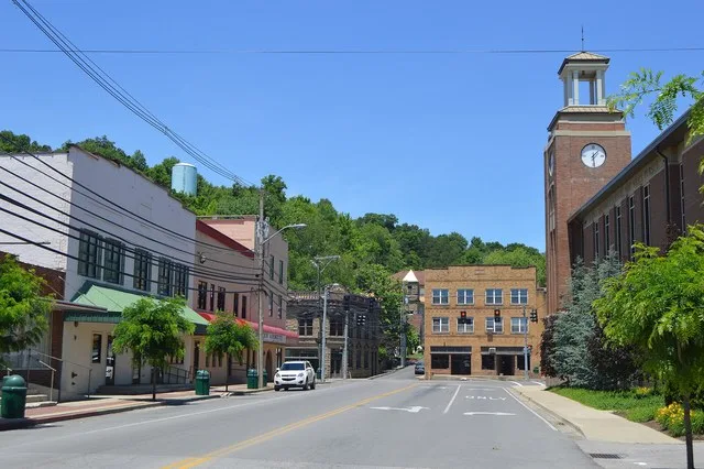 Looking northward toward the junction of Church and Maple Streets ( U.S. Route 460 /Kentucky Routes 7 and 40 ) in downtown Salyersville , Kentucky , United States . The building i...