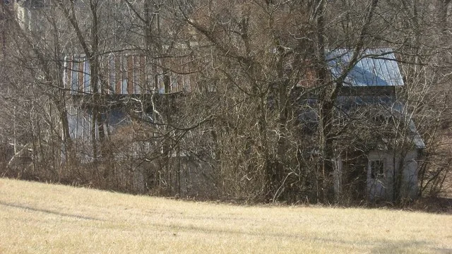 Northern side of the Finney Hotel , located off the Woodbury Loop in Woodbury , Kentucky , United States . Built in 1890, it is listed on the National Register of Historic Places .