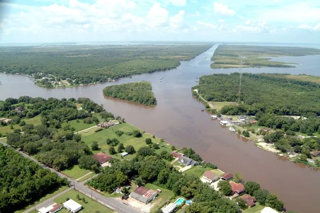 Aerial view of a northern section of Jean Lafitte, Louisiana at the Gulf Intracoastal Waterway (GIWW). The waterway stretches off to the southwest at the top of the picture and al...