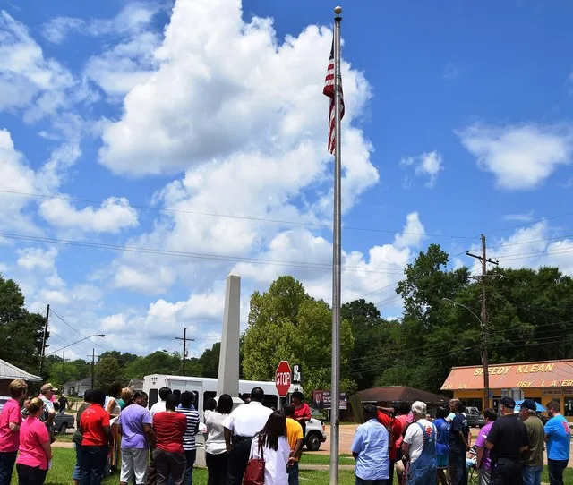 Kentwood residents gather outside the Town Hall alongside LA 38 for a noontide Day of Prayer in 2015.