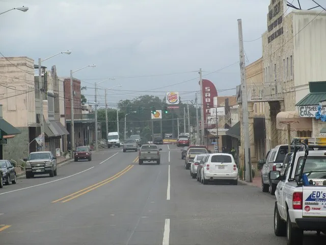 Louisiana Route 6 in central Many, Louisiana, looking west, 2013. Many vehicles travel this road each year.