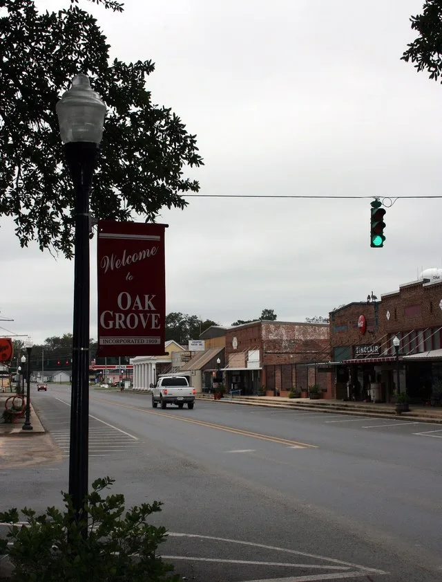 LA Highway 2 (Main Street here), facing west/north-west from the north-west corner of the court-house square. The old downtown.