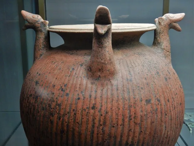 Ribbed olla in red body ceramic with four griffin prothromes. The olla is part of the grave goods of the Tomb of the Flabelli and was intended for mixing water and wine, closely l...