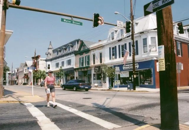 Scope and content: The original finding aid described this photograph as: Original Caption: Byway Enthusiast crosses at the intersection of Commerce and Water Street in downtown C...