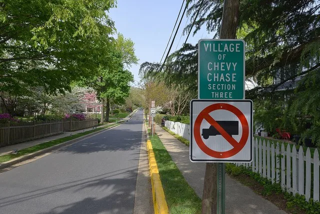 Sign and entrance road to the Village of Chevy Chase Section Three in Maryland.