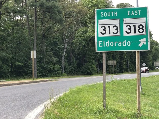 View north along Maryland State Route 307 (Williamsburg Road) at the exit for Maryland State Route 313 SOUTH and Maryland State Route 318 EAST (Eldorado) just southwest of Federal...