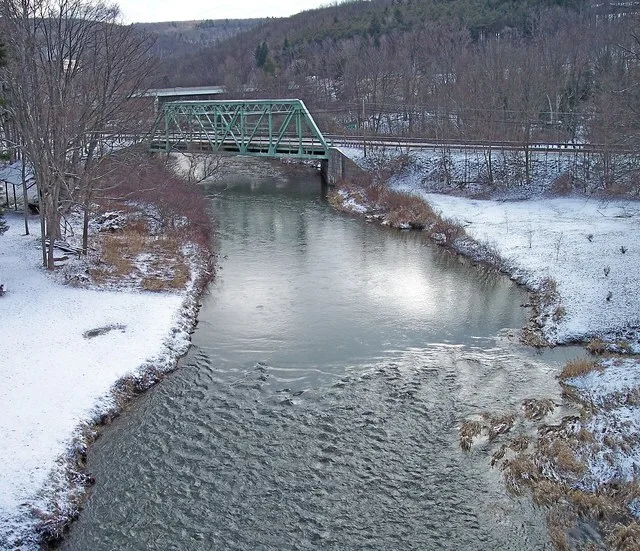 The Casselman River as viewed upstream from Casselman River Bridge State Park near Grantsville, Maryland . The bridge carries the National Pike ( Alternate U.S. Route 40 ). Inters...
