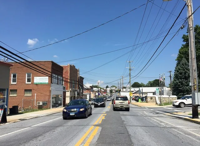 View north along Maryland State Route 30 Business (Main Street) at Maryland State Route 833 (Black Rock Road) in Hampstead, Carroll County, Maryland