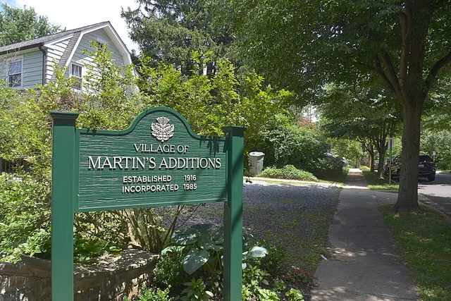 The sign at the entrance to the Village of Martin's Additions, Maryland. This sign is at the corner of Brookville Road and Quincy Street.