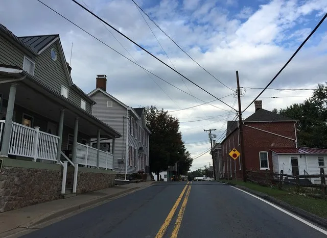 View west along Maryland State Route 107 (Fisher Avenue) at Norris Road in Poolesville, Montgomery County, Maryland