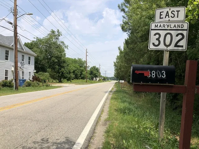 View east along Maryland State Route 302 (Barclay Road) at Maryland State Route 454 (Crown Stone Road) in Templeville along the border of Caroline County and Queen Anne's County i...