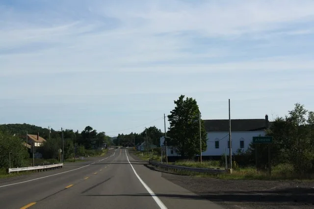The sign for w:Ahmeek, Michigan on w:U.S. Route 41 . This file was uploaded with Commonist .