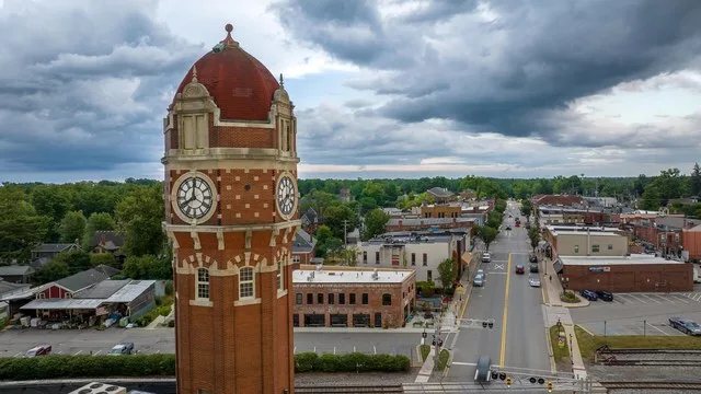 Drone photo of Downtown Chelsea, Michigan with the clocktower in the foreground.