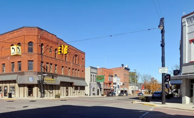 The northwest corner of the main two roads that cross in Fowlerville, MI .