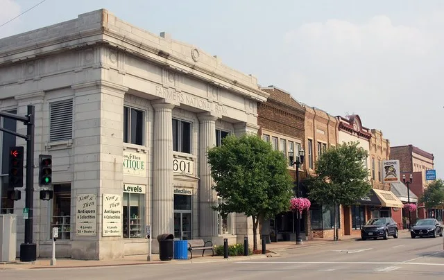 Businesses on southeast corner of Broadway Street at 6th Avenue Former Farmers National Bank building on corner Alexandria, Minnesota, USA