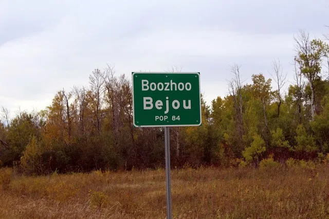 City limit sign "Boozhoo" is an Ojibwe greeting that means "hello" or "greetings." Bejou, Minnesota [ 1 ] Bejou, Minnesota