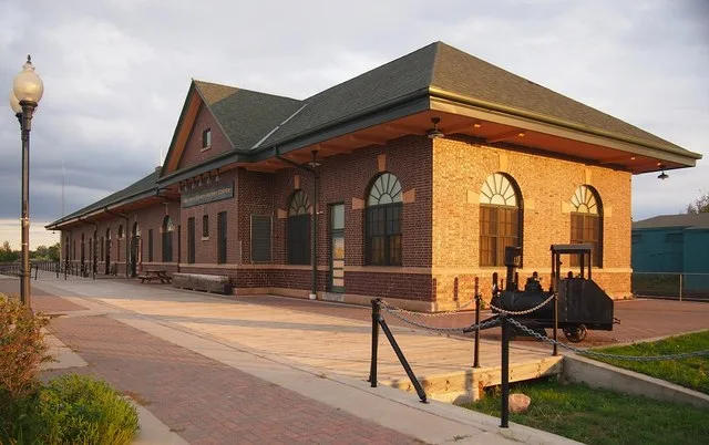 Great Northern Depot (now the Beltrami County History Center), Bemidji, Minnesota, USA. Viewed from the northwest during a brief period of golden hour light on a cloudy evening.