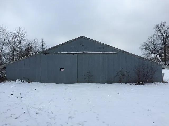 Turkey barn in Carlos, Minnesota, erected around 1960. The words at the top read: "FRESH OVEN READY TURKEYS".
