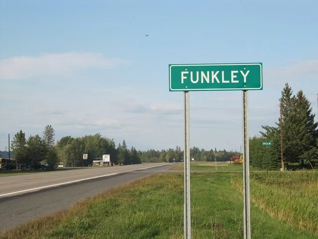 Funkley, MN road sign with Funkley Bar in the background. County Road 71.