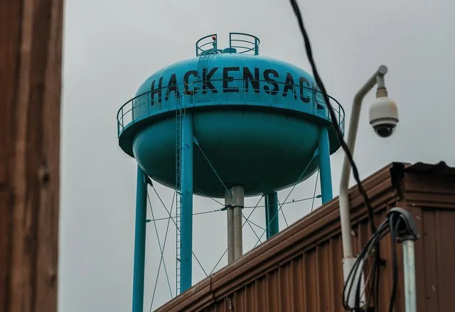 The water tower in the city of Hackensack, Minnesota, with the Hackensack Community Center in the foreground.