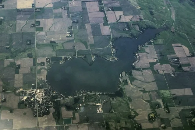 An aerial view of Lake Hendricks, a lake straddling the Minnesota-South Dakota border, and the town of Hendricks, Minnesota on its shore.
