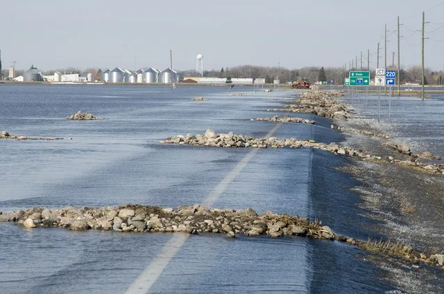 Oslo, MN, April 9, 2009 -- Unusual mitigation methods to control road erosion being employed to the roadbed of Rt. 1 East of Oslo, MN while Red River floodwater overtakes the road...