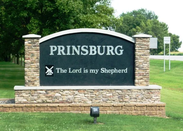City sign on state highway 7 for Prinsburg, Minnesota, with Biblical verse from Psalms 23, The Lord is my shepherd.