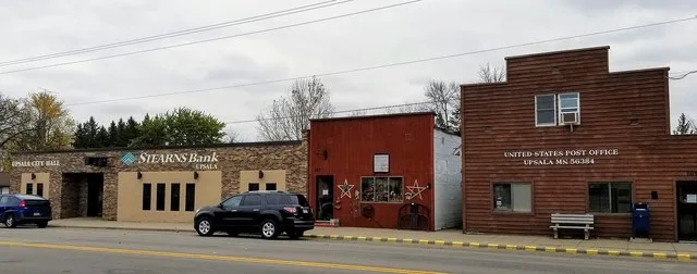 Buildings along Minnesota State Highway 238 in Upsala, Minnesota, including the Upsala post office and city hall