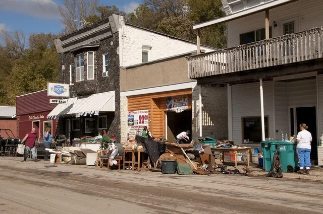 Zumbro Falls, MN, September 28, 2010 -- Business owners clean debris from their businesses after the town was by flood waters from the Zumbo river. FEMA and the Minnesota Emergenc...
