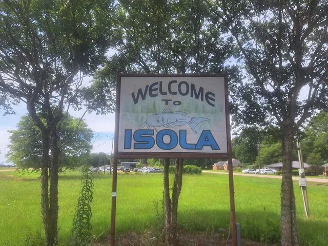 Welcome sign to Isola, MS, located on Highway 49 West