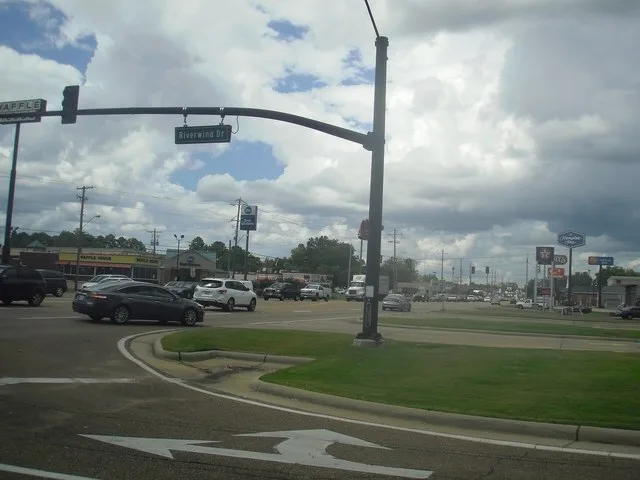 An intersection between Riverwind Drive and South Pearson Road .