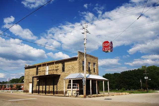 Building at the corner of Main and Front streets in Rienzi, Mississippi, United States. This building is listed on the National Register of Historic Places as a contributing prope...