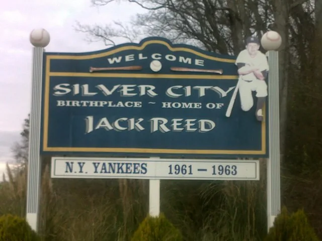 Sign along US 49W indicating Silver City as the birthplace of MLB player Jack Reed