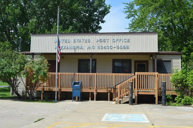 Front of the Alexandria post office, located at 303 Market Street in Alexandria , Missouri , United States .