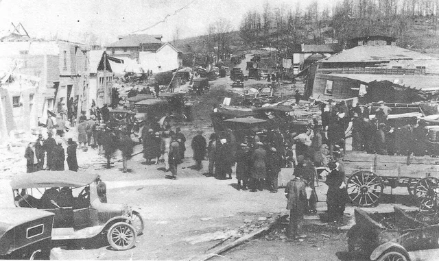 People scouring around the destruction on Allen Street, facing north in
