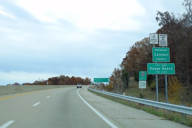 US54 West - Entering Camden County Osage Beach Signs