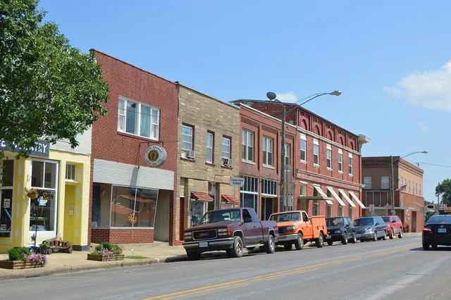 Buildings on the eastern side of Fourth Street (formerly U.S. Route 61) between Lewis and Clark Streets in downtown Canton , Missouri , United States .
