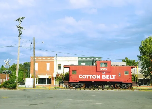 St. Louis Southwestern (Cotton Belt Railroad) caboose and buildings along Main Street in East Prairie, Missouri, United States.