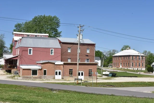 Gerald Roller Mill (foreground) and old Public School (background) in Gerald, Missouri
