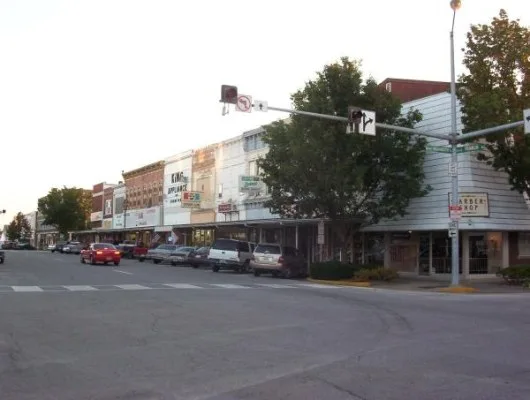 A barbershop, a cafe, and other businesses on the square. Taken in 2004. Kirksville, MO